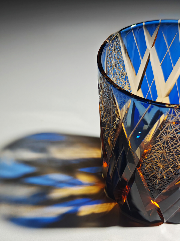 Thunder Gods Edo Kiriko whiskey glass with blue and amber crystal daisy pattern